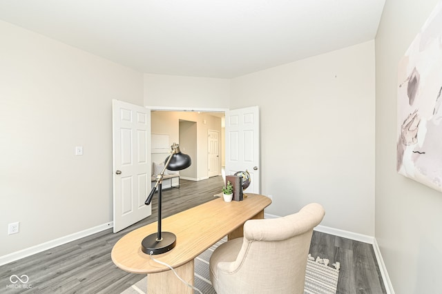 home office with wood finished floors and baseboards