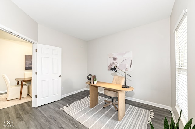 home office with baseboards and dark wood finished floors