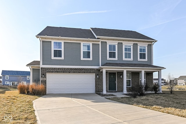 view of front facade featuring driveway, a porch, a front yard, a garage, and brick siding