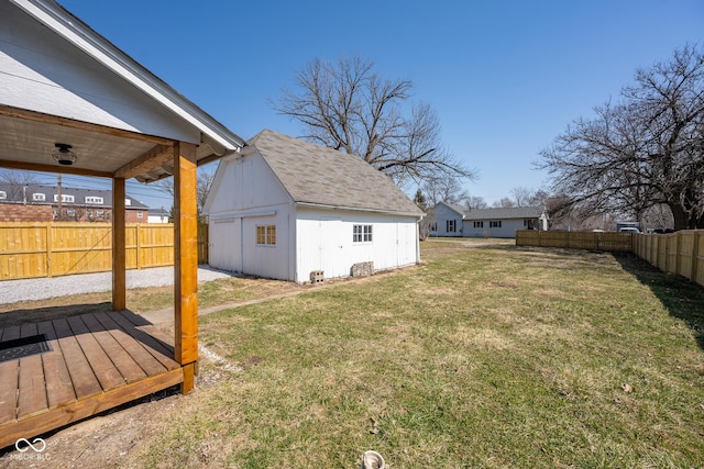 view of yard with an outbuilding and a fenced backyard