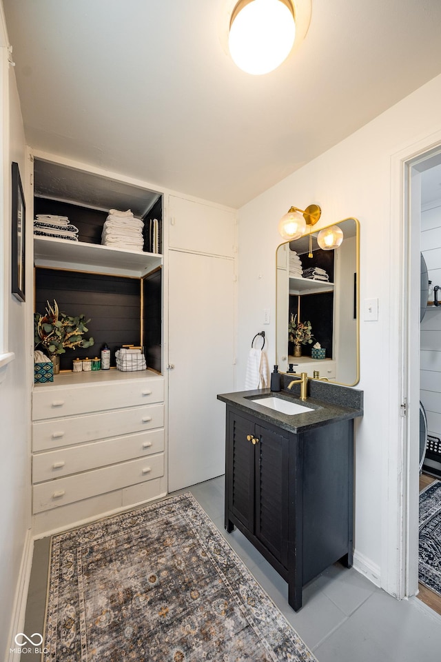 interior space featuring baseboards and vanity