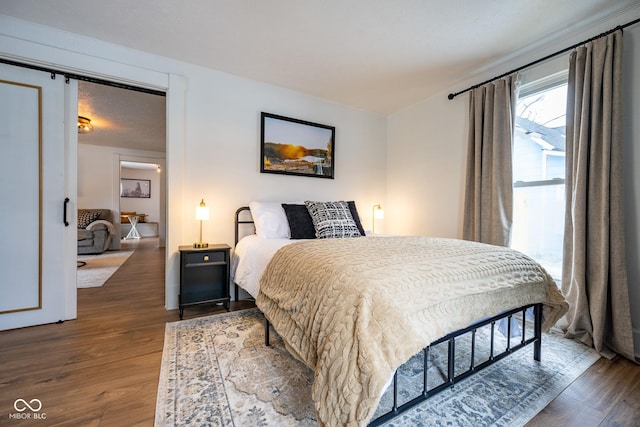 bedroom featuring wood finished floors