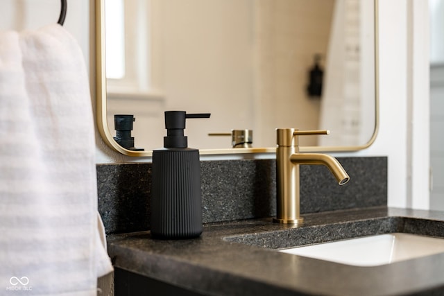 room details with tasteful backsplash and a sink