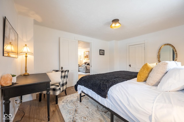 bedroom featuring a closet and wood finished floors