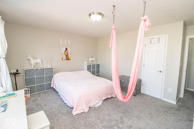 bedroom featuring carpet and baseboards