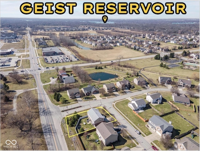 birds eye view of property featuring a residential view and a water view