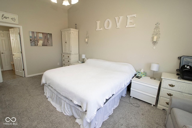 carpeted bedroom featuring baseboards