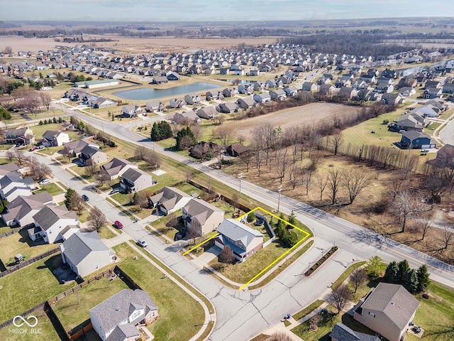 aerial view with a residential view and a water view