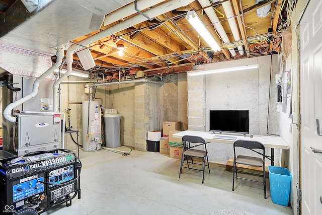 unfinished below grade area featuring gas water heater and washer / dryer