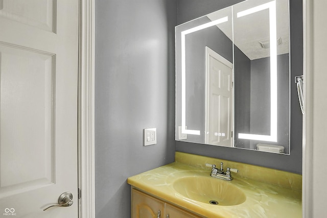 bathroom featuring visible vents and vanity