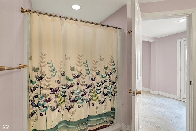 bathroom with a shower with curtain, recessed lighting, and baseboards