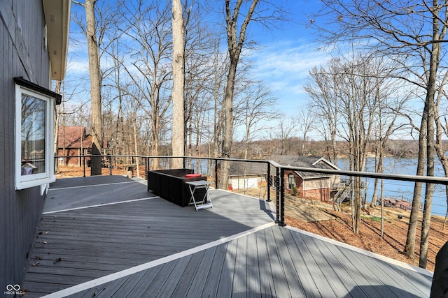 wooden deck with a water view