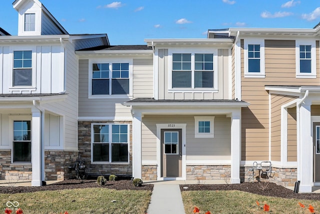 view of front of house featuring stone siding and board and batten siding