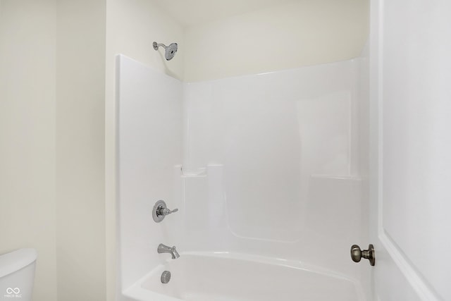 bathroom with toilet and shower / bathtub combination