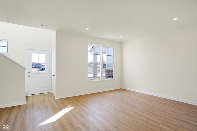 foyer entrance with recessed lighting, visible vents, baseboards, and light wood finished floors