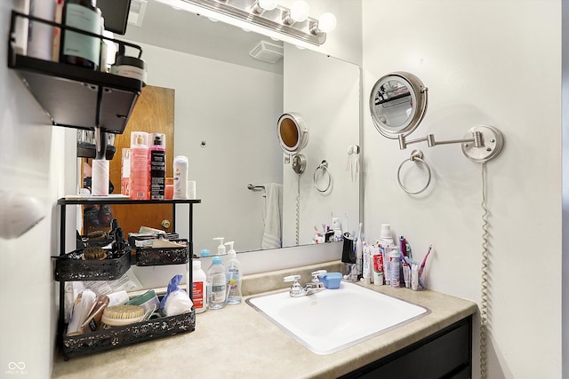 bathroom featuring visible vents and vanity