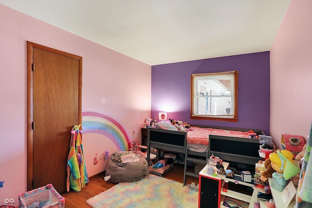 bedroom with wood finished floors