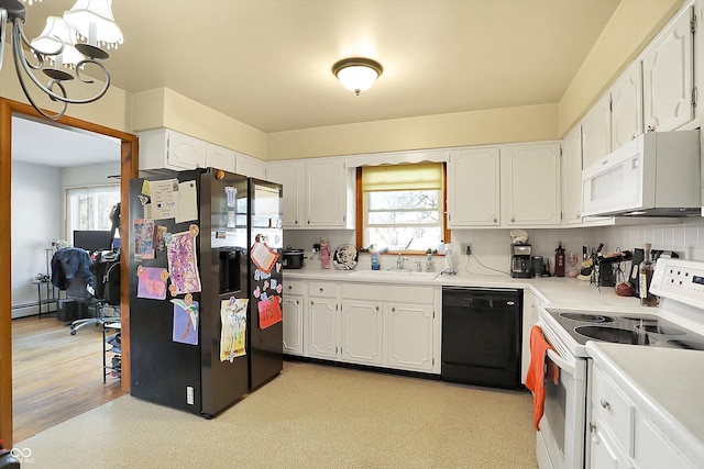 kitchen featuring decorative backsplash, white appliances, white cabinets, and a sink