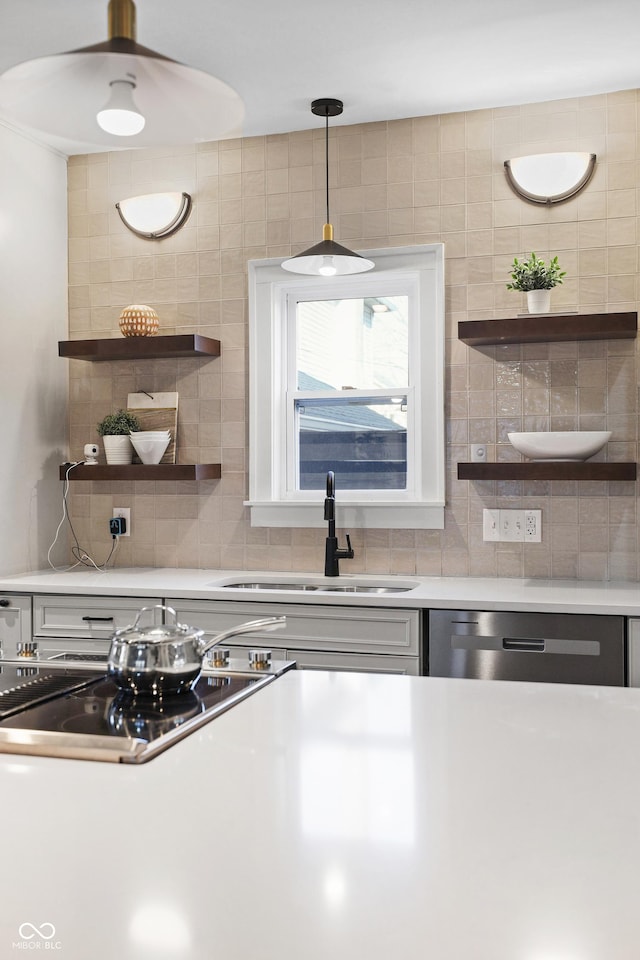 kitchen featuring a sink, open shelves, stainless steel dishwasher, backsplash, and stovetop with downdraft