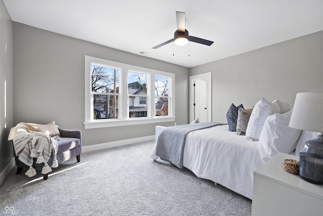 bedroom featuring carpet flooring, a ceiling fan, and baseboards