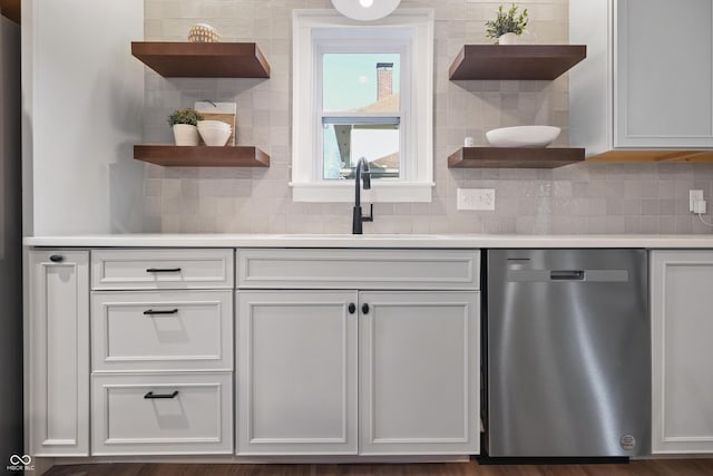 kitchen with dishwasher, open shelves, light countertops, and a sink