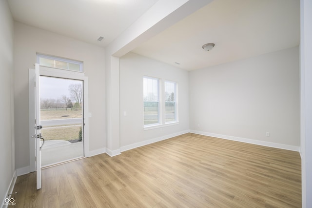 interior space with light wood-type flooring and baseboards