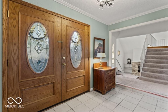 2447 N E Raintree Dr, New Castle, IN 47362 - foyer entrance with plenty of natural light, light tile patterned floors, stairs, a textured ceiling, and ornamental molding