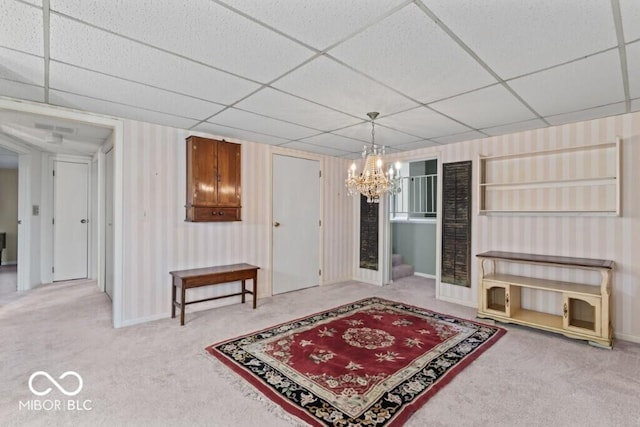 2447 N E Raintree Dr, New Castle, IN 47362 - dining area with carpet flooring, a paneled ceiling, a chandelier, and wallpapered walls