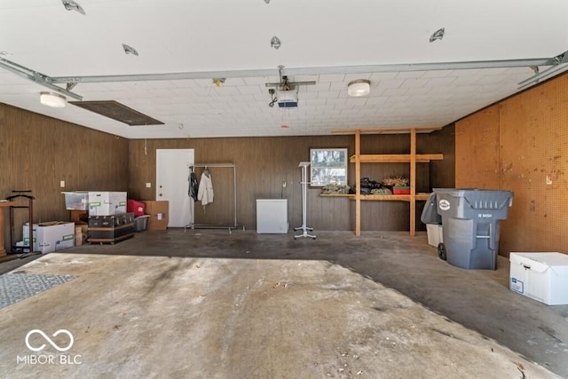2447 N E Raintree Dr, New Castle, IN 47362 - garage with wood walls and a garage door opener