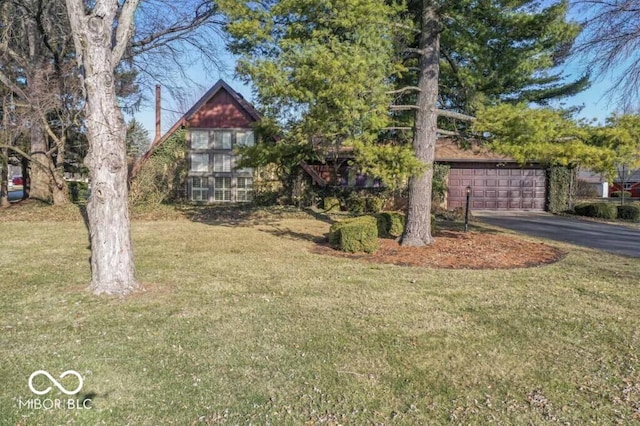 2447 N E Raintree Dr, New Castle, IN 47362 - view of front facade featuring a garage, a front yard, and driveway