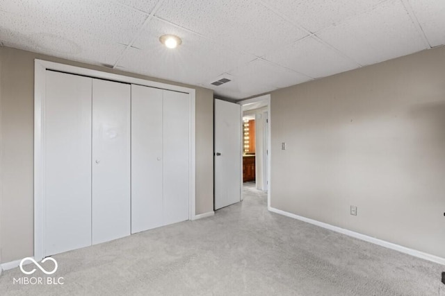 2447 N E Raintree Dr, New Castle, IN 47362 - unfurnished bedroom with carpet, a closet, and a drop ceiling