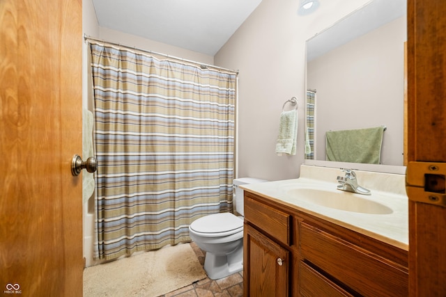 bathroom with toilet, shower / bath combo, vanity, and stone finish floor