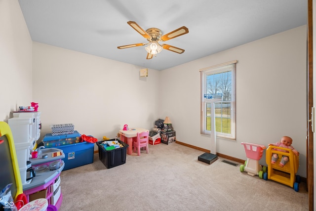 game room featuring visible vents, baseboards, ceiling fan, and carpet flooring