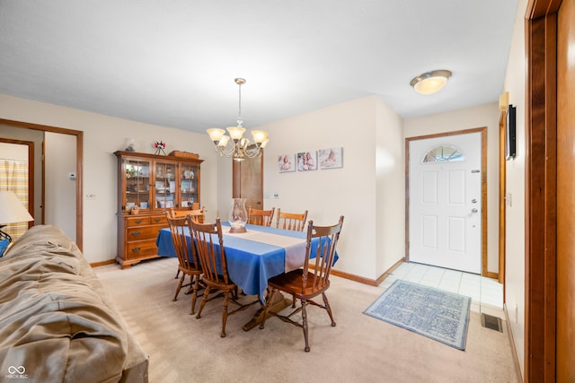 dining area with light carpet, visible vents, baseboards, and an inviting chandelier