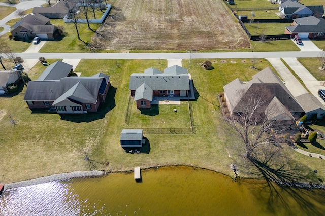 aerial view with a residential view and a water view