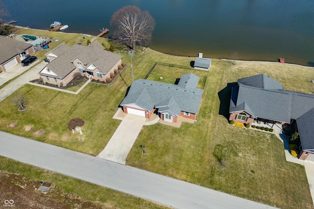 bird's eye view with a residential view and a water view