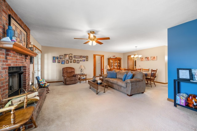 living area featuring ceiling fan with notable chandelier, a brick fireplace, baseboards, and carpet