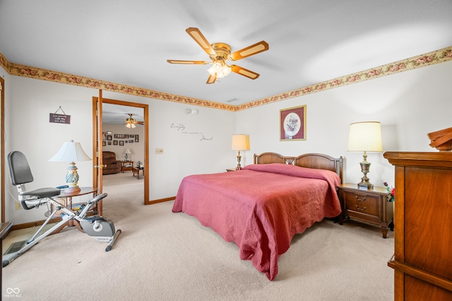 bedroom featuring baseboards, light colored carpet, and a ceiling fan