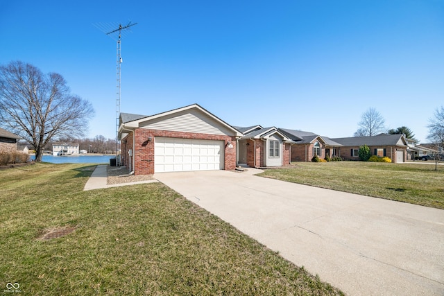 ranch-style home featuring brick siding, an attached garage, driveway, and a front lawn