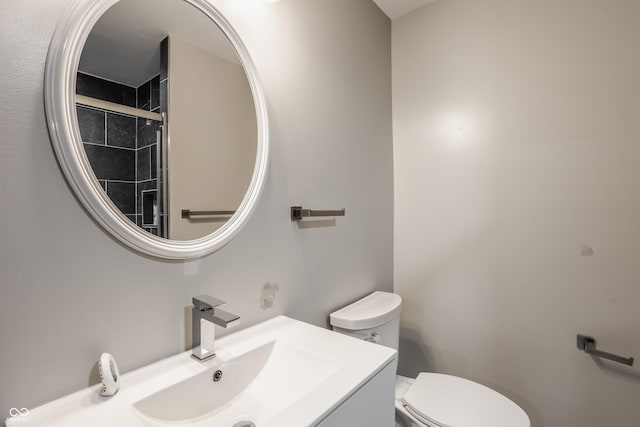 bathroom featuring toilet and vanity