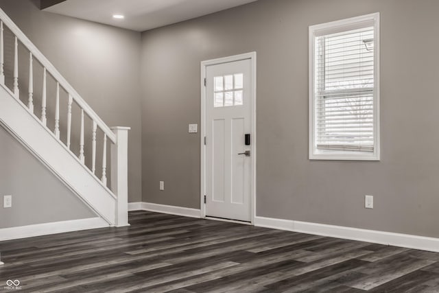 entryway with stairway, recessed lighting, baseboards, and dark wood-style flooring