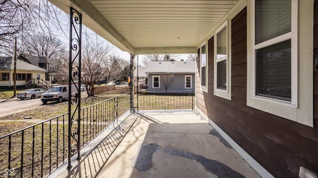 view of patio / terrace featuring a residential view and covered porch