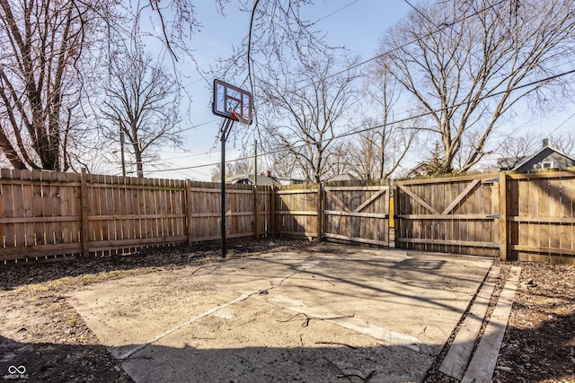 view of yard featuring fence and a gate