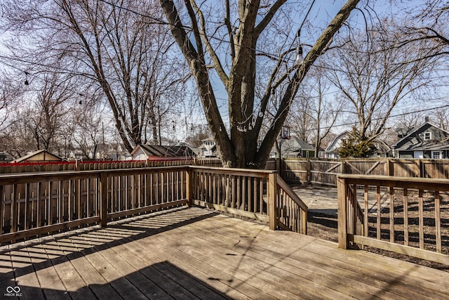 deck featuring a residential view and a fenced backyard