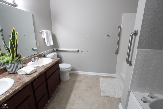 full bathroom with toilet, double vanity, a bath, and a sink