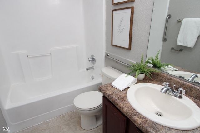 full bath featuring tile patterned floors, bathing tub / shower combination, toilet, and vanity