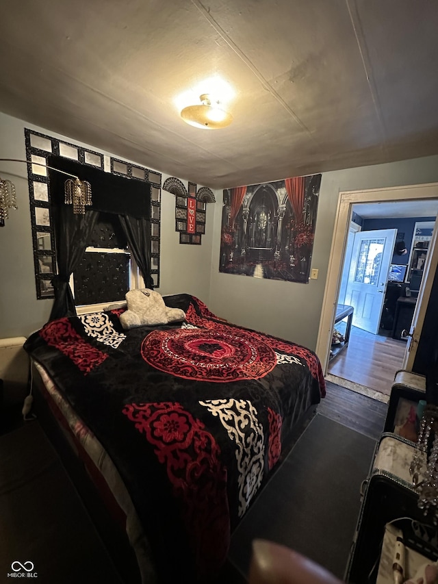 bedroom featuring wood finished floors