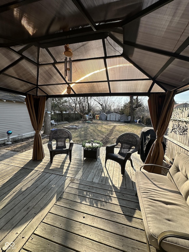 wooden terrace with a gazebo