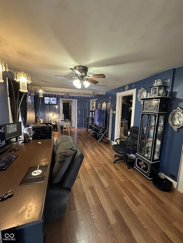 home office with a ceiling fan and wood finished floors