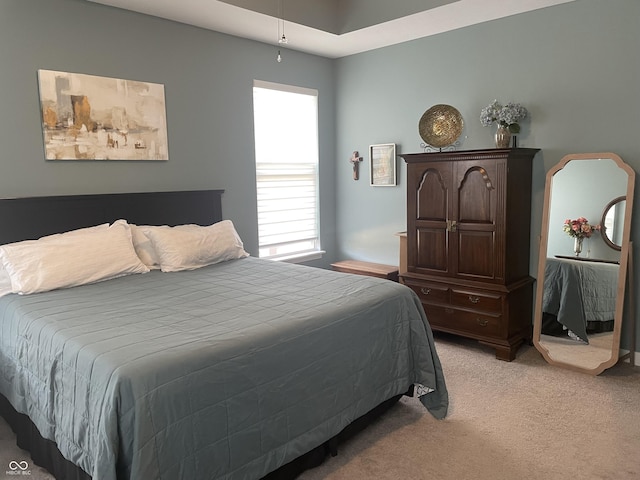 bedroom with light colored carpet